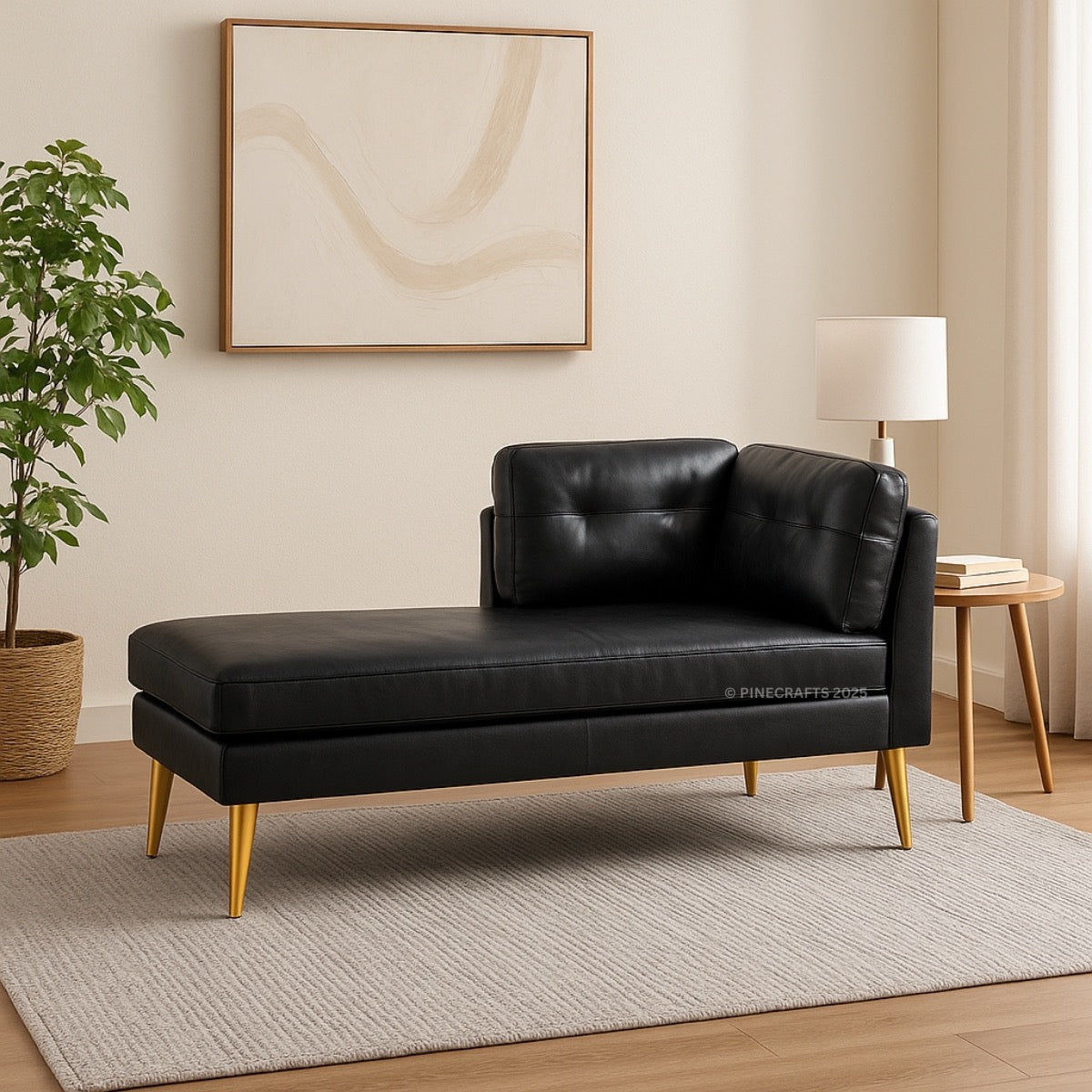 Black leather sofa in a living room setting with a plant, table, and abstract art on the wall.